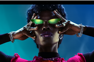 Colourful screen on a MacBook Pro of a person crowdsurfing at a party, showcasing the vibrant Liquid Retina XDR display